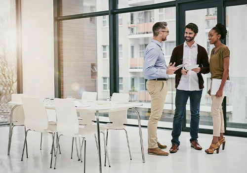 Conference room with happy people standing